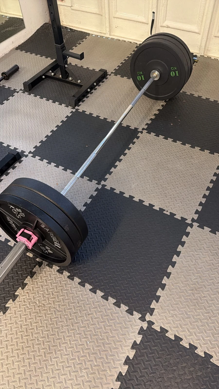 Loaded barbell on a gym floor